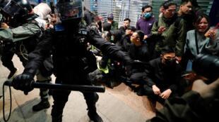 Hong Kong police confront demonstators in violent clashes during New Year's Day rally, 1 January 2020.
