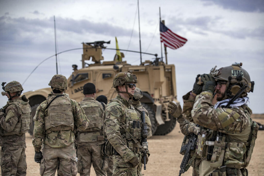US soldiers on a joint military exercise between the SDF and the US-led international coalition against the Islamic State group, in Deir Ezzor, northeastern Syria.