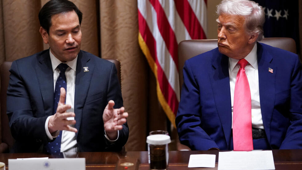 U.S. President Donald Trump listens as Secretary of State Marco Rubio speaks during a cabinet meeting at the White House in Washington, D.C., U.S., April 10, 2025. REUTERS/Nathan Howard