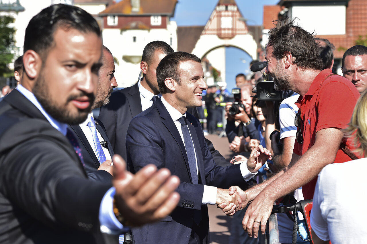 Former presidential aide Alexandre Benalla (left), accused of abuse of power and violence against protesters, caused a big upset in Macron's government. (Both pictured here at Le Touquet, France, June 2017)