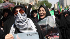 Des personnes assistent à une manifestation anti-israélienne suite aux frappes israéliennes sur l'Iran, à Téhéran, Iran, 13 juin 2025.