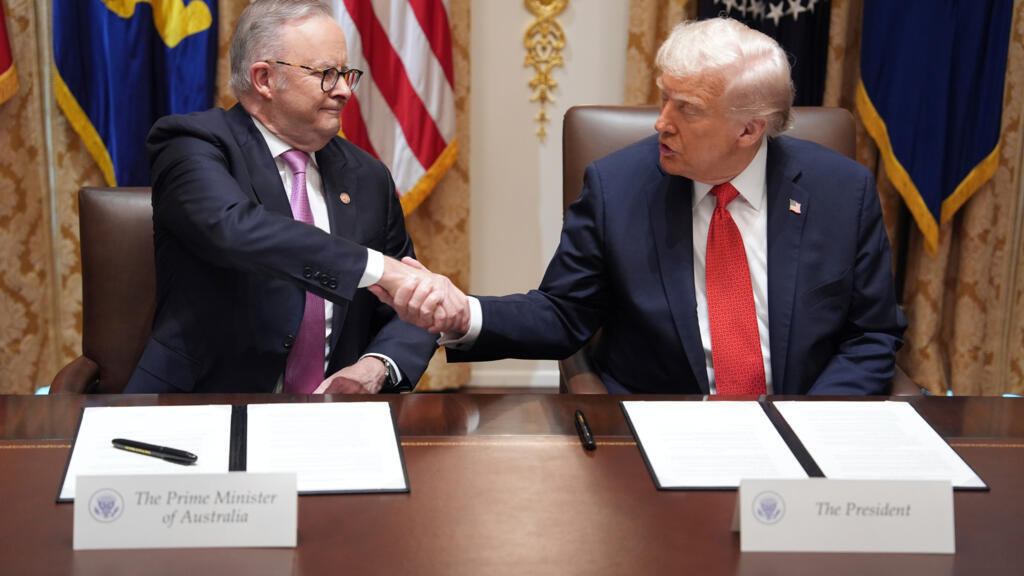 President Donald Trump, right, shakes the hand of Australian Prime Minister Anthony Albanese during a meeting in the Cabinet Room of the White House, Monday, October 20, 2025, in Washington. (AP Photo