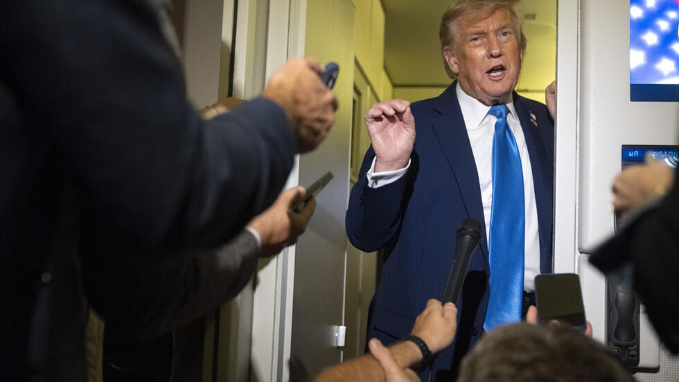 President Donald Trump speaks with reporters while flying aboard Air Force One en route from Calgary, Canada to Joint Base Andrews, Md., late Monday, June 16, 2025.