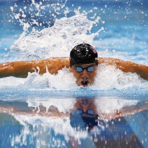 Michael Phelps as he swims his men's 100m butterfly semi-final at the Aquatics Centre, 2 August , 2012