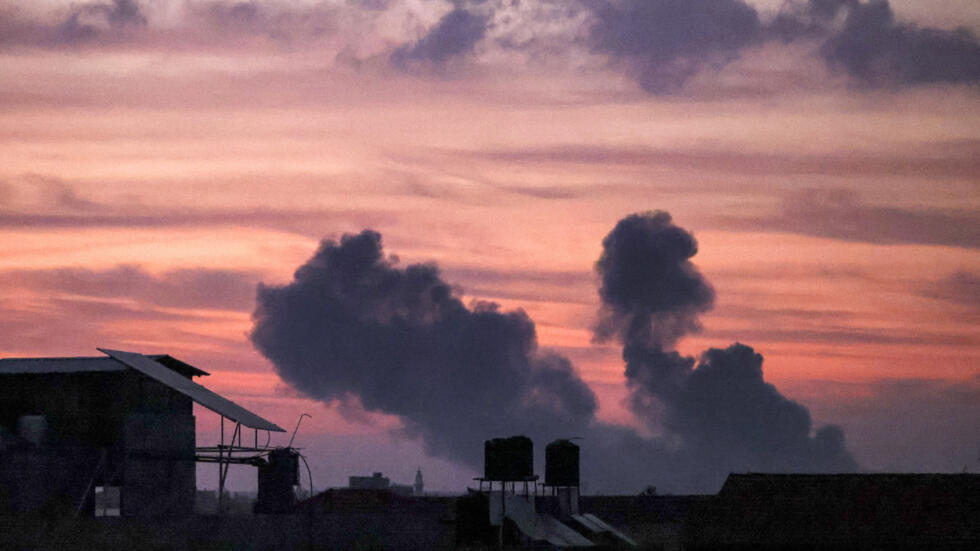 Smoke plumes rise following Israeli bombardment in Gaza City early on October 11, 2023. 