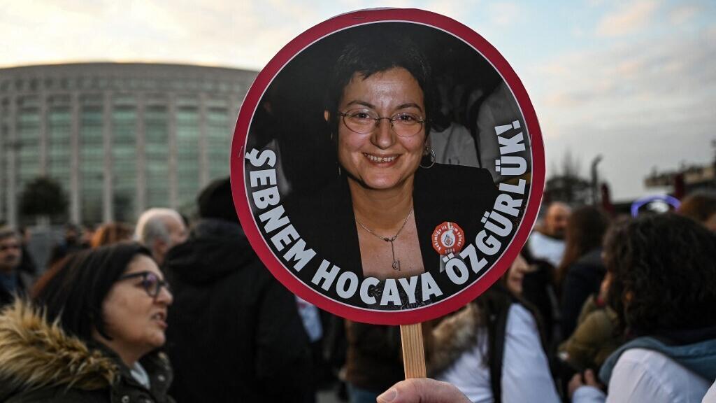 A protester holds a placard of Turkey's Medical Association President Sebnem Korur Fincanci, reading "We want freedom for Sebnem", on 23 December 2022.