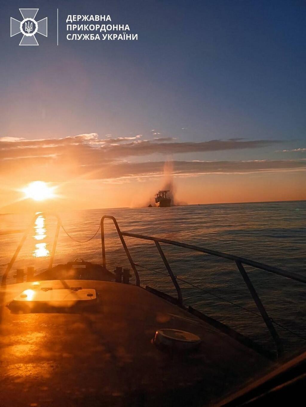 This handout picture released by the Ukrainian Border Guards Press Service on December 28, 2023 shows a commercial ship damaged by Russian naval mine in the Black Sea.