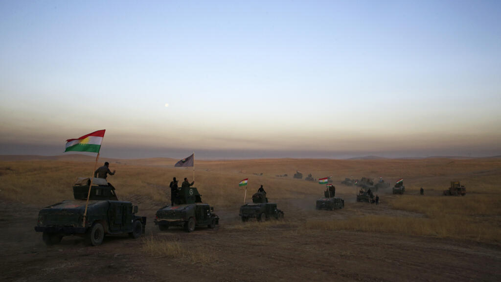 A Kurdish Peshmerga convoy drives towards Khazer, east of Mosul in northern Iraq, on 17 October 2016.