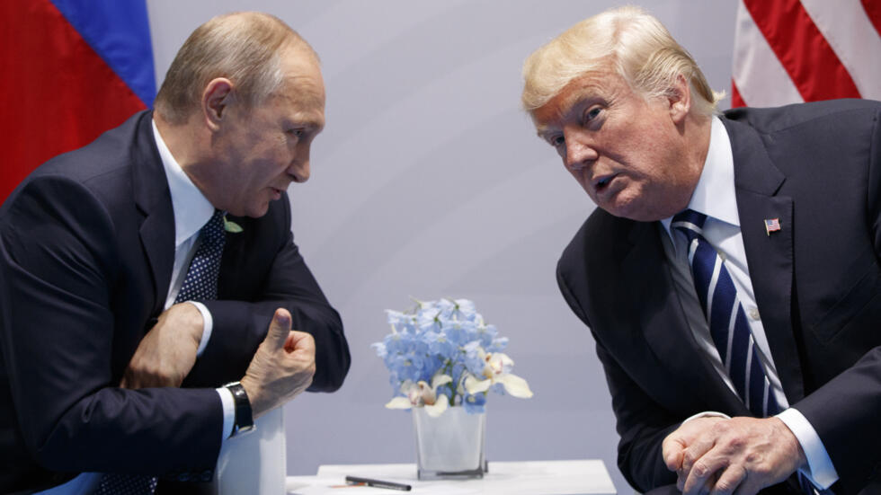 FILE - President Donald Trump, right, meets with Russian President Vladimir Putin at the G-20 Summit in Hamburg, July 7, 2017. (AP Photo/Evan Vucci, File)