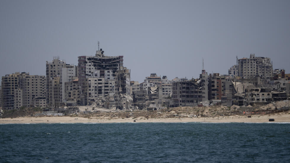 Destroyed buildings stand in the coast of the Gaza Strip as seen from the Mediterranean Sea, Tuesday, June 25, 2024.