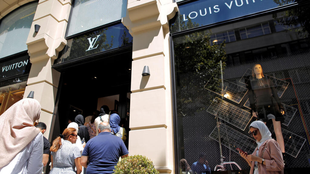 Tourists line up to enter at a Louis Vuitton store in Istanbul, Turkey.