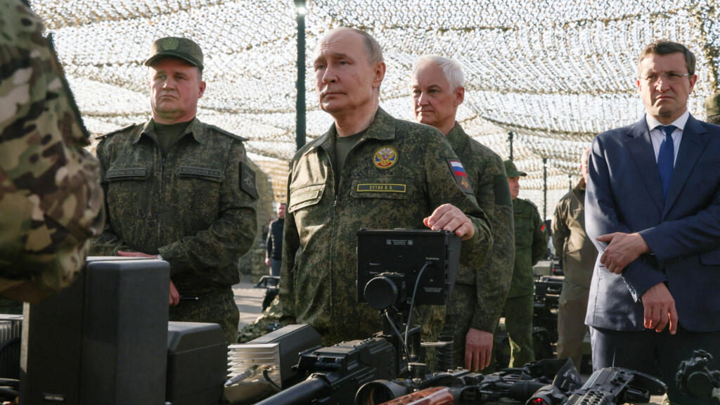 Russian President Vladimir Putin meets with service members and inspects equipment as he arrives to observe the Russia-Belarus joint military exercises, codenamed Zapad-2025 (West-2025), at the Mulino