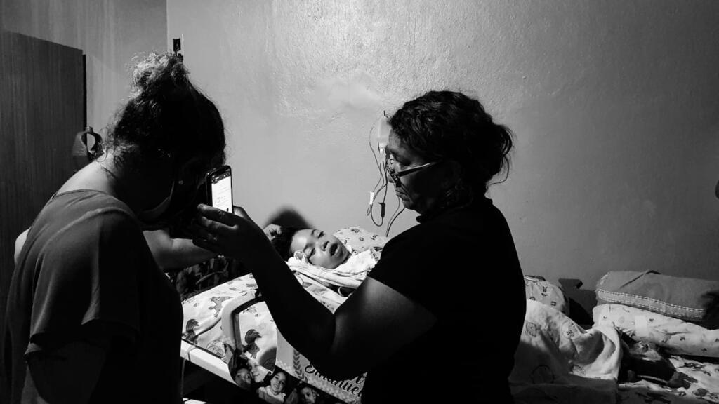 Nine-year-old Davi and Cintia, residents of Manaus; both infected with coronavirus and struggling to pay for oxygen to keep the boy alive.