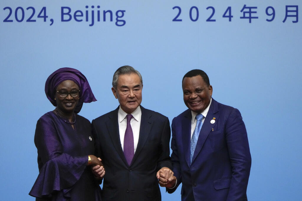 China's foreign minister Wang Yi with his counterparts Senegal's Yassine Fall and Congo's Jean-Claude Gakosso at the China Africa Forum in Beijing, on 5 September 2024.