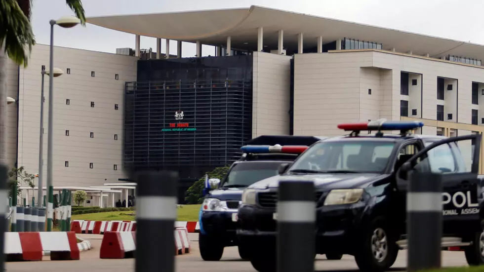 Police vehicles outside the National Assembly in Abuja on August 7, 2018.
