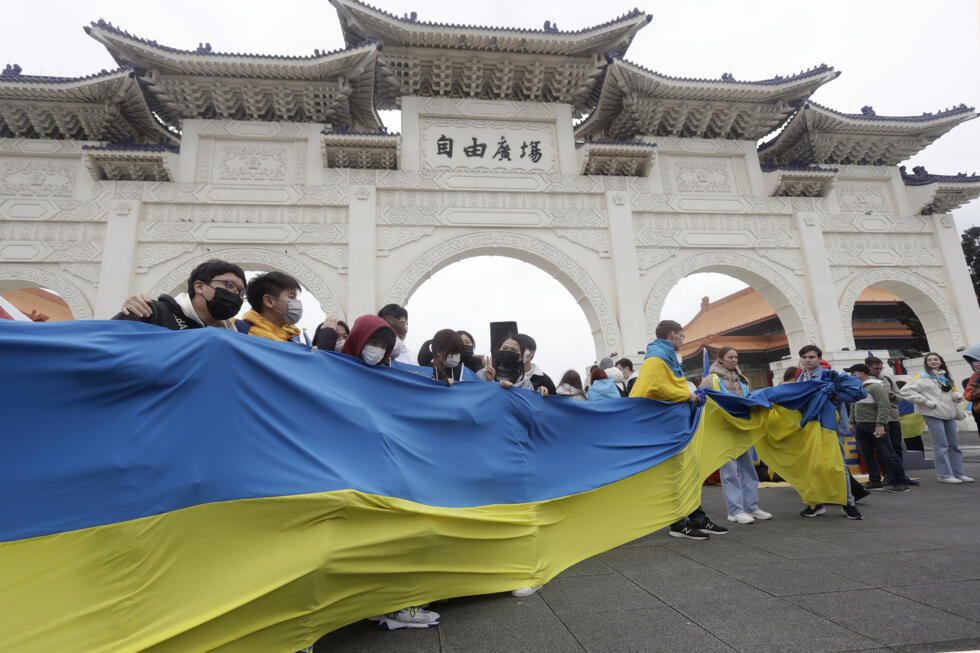 Russia Ukraine War Global Reaction A group of Ukrainian people in Taiwan and supporters hold Ukraine national flag during a protest, marking one year since the Russian invasion of Ukraine, at Liberty