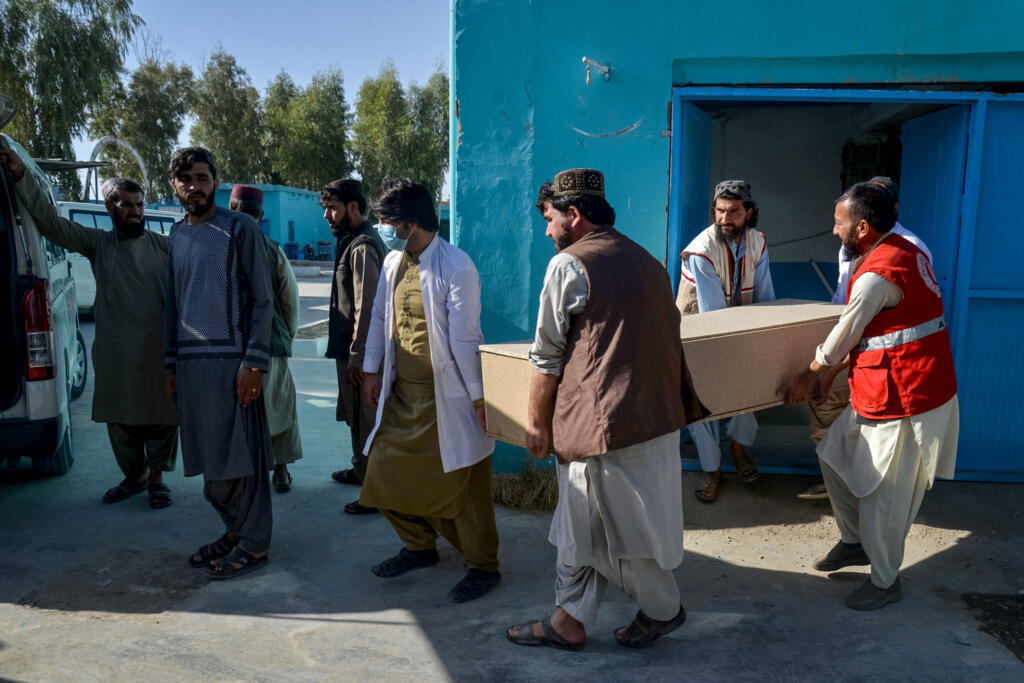 People in Afghanistan transfer coffins of Pakistani security personnel in Spin Boldak, a focal point of recent clashes