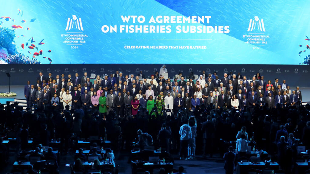 Delegates pose for a family photo during the 13th WTO ministerial conference in Abu Dhabi, United Arab Emirates, February 26, 2024.