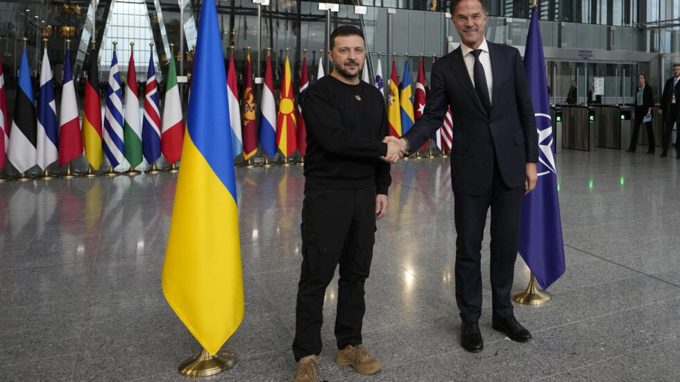 NATO Secretary General Mark Rutte, right, shakes hands with Ukraine's President Volodymyr Zelenskyy prior to a meeting at NATO headquarters in Brussels, Thursday, Oct. 17, 2024.