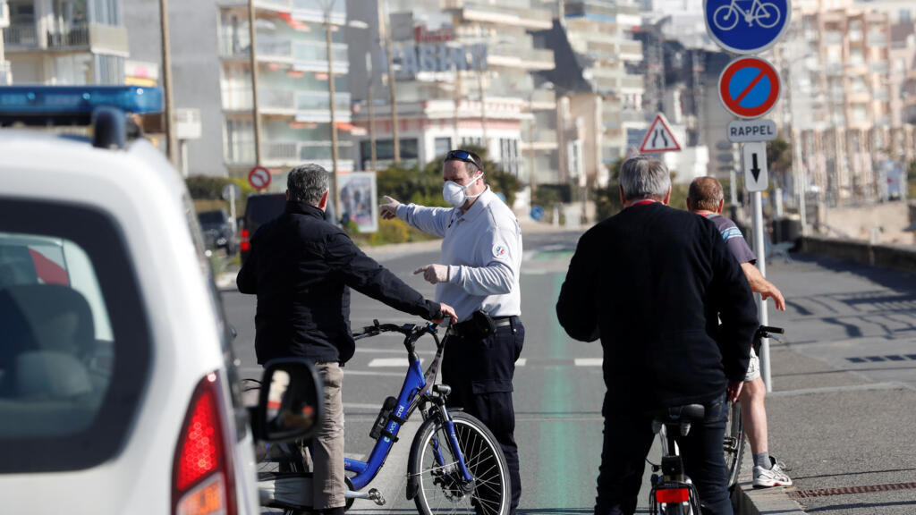 French police control people and evacuate the beach in Pornichet near La Baule as a lockdown is imposed to slow the rate of the coronavirus disease (COVID-19) in France, March 18, 2020.