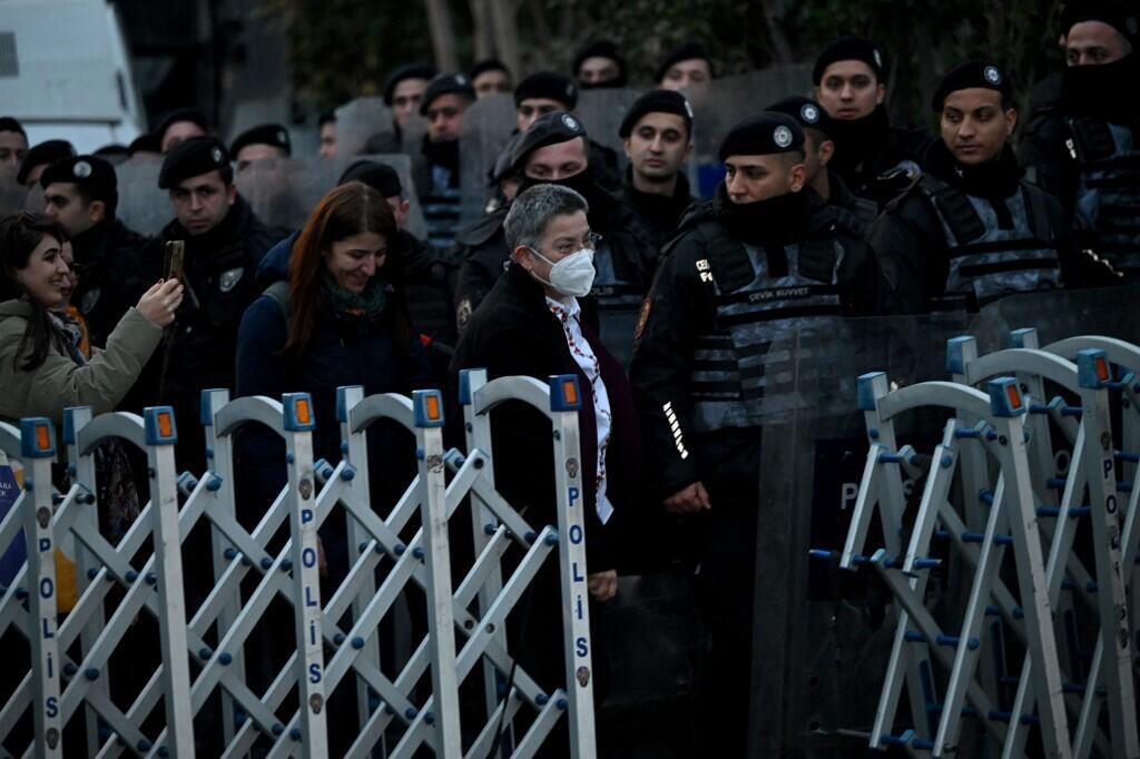 Turkish Medical Association head Sebnem Korur Fincanci (C) exits a police checkpoint after being released from the Bakirkoy prison in Istanbul on 11 January 2023.