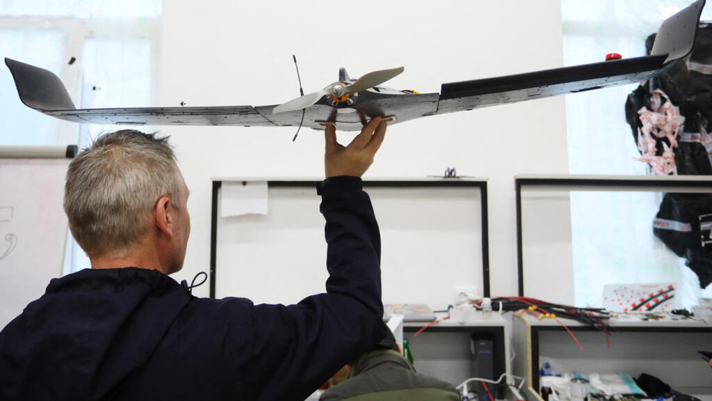 An Ukrainian activist carries a drone in western Lviv, on 1 April, 2022.