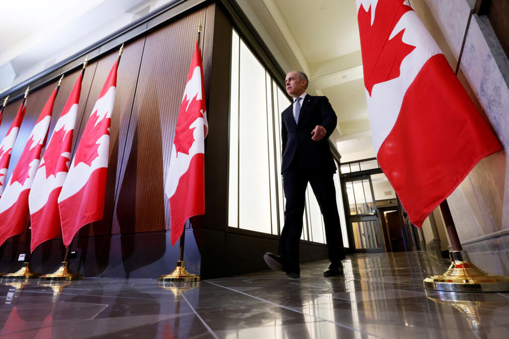 Canada's Prime Minister Mark Carney arrives at a press conference to discuss a response to US President Donald Trump's new tariffs, in Ottawa on 27 March, 2025.