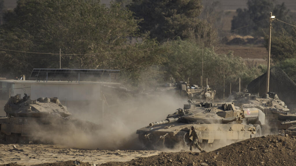 An Israeli tanks move near the border of the Gaza Strip in southern Israel, Wednesday, Aug. 6, 2025. (AP Photo/Ohad Zwigenberg)