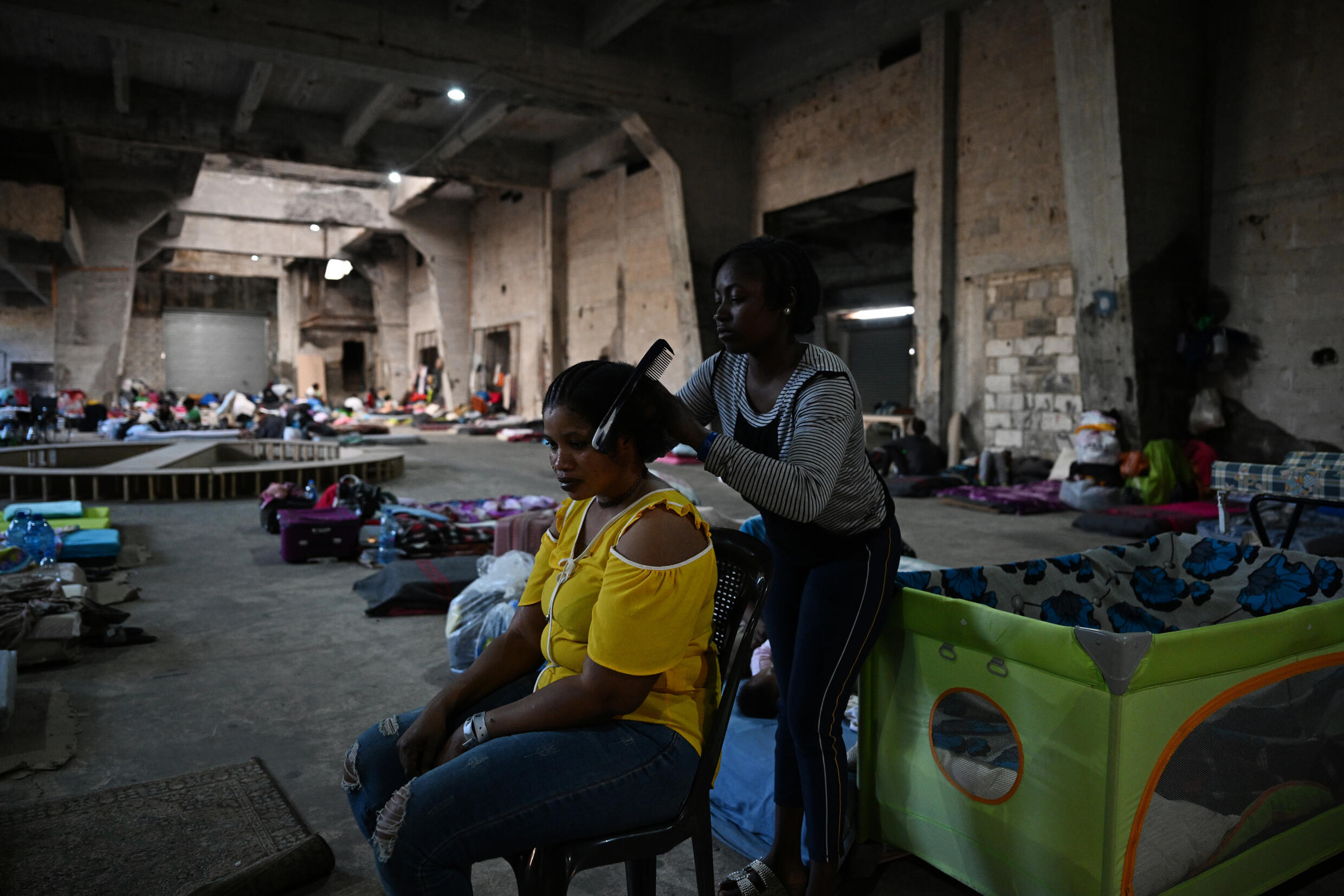 Stranded in Lebanon, Sierra Leone women shelter from war in warehouse