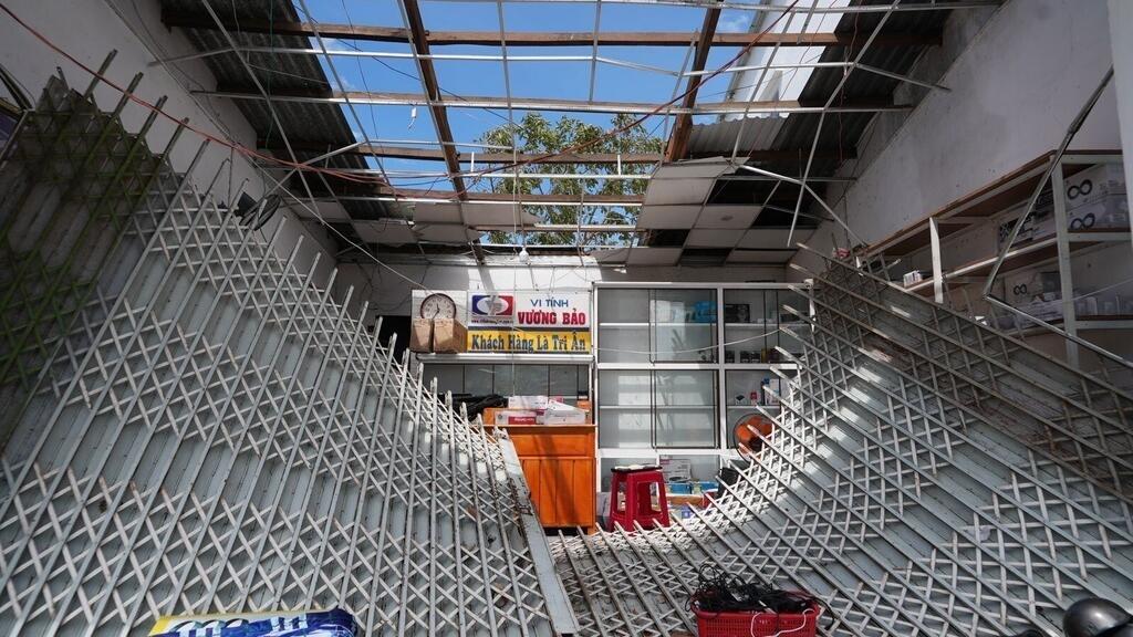 A damaged roof and an entrance in Dak Lak, Vietnam on Friday, Nov. 7, 2025 after Typhoon Kalmaegi lashed Vietnam with fierce winds and torrential rains. (AP Photo/Hau Dinh)