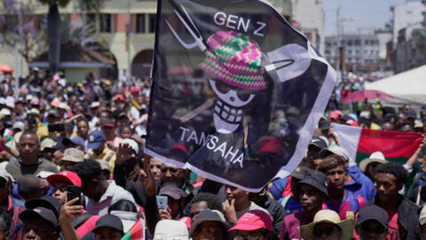 Young protesters in Madagascar wave their take on the flag which has rallied Gen Z movements worldwide, at a gathering in Antananarivo on 18 October 2025.