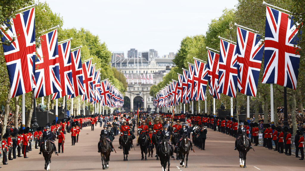 The funeral procession marches down The Mall following the service at Westminster Abbey, on the day of the state funeral and burial of Britain's Queen Elizabeth, in London, Britain, September 19, 2022 REUTERS/Andrew Boyers