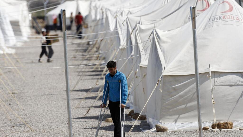 A Syrian refugee walks at Islahiye refugee camp in Gaziantep, southern Turkey, on April 3, 2012.
