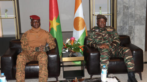 Burkina Faso's Captain Ibrahim Traore sit next to Niger's General Abdourahamane Tiani in Niamey, on 5 July 2024. 