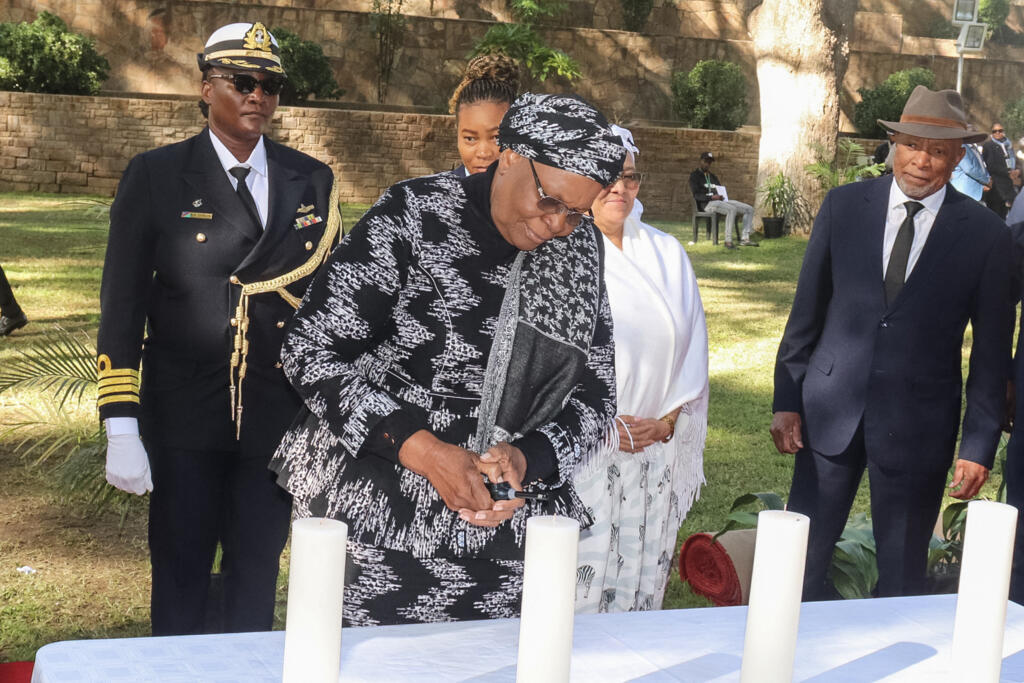 Namibia's President Netumbo Nandi-Ndaitwah lights a candle during the Genocide Remembrance Day at the Parliament Gardens in Windhoek, on 28 May 2025. 