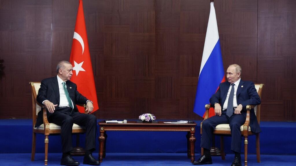 Russian President Vladimir Putin with Turkey's President Recep Tayyip Erdogan at a regional conference in Kazakhstan on 13 October 2022.