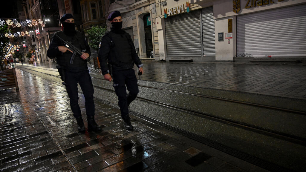 Turkish police officers patrol Istiklal avenue in Istanbul on November 21, 2020.