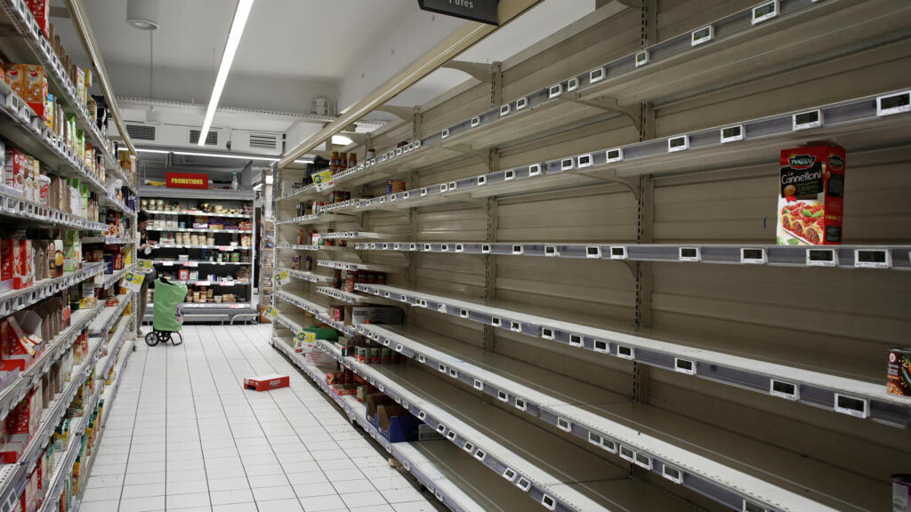 A view shows empty shelves at a Super U supermarket as people began stockpiling food in Paris, as France grapples with an outbreak of coronavirus disease (COVID-19), March 14, 2020. REUTERS/Benoit Tessier