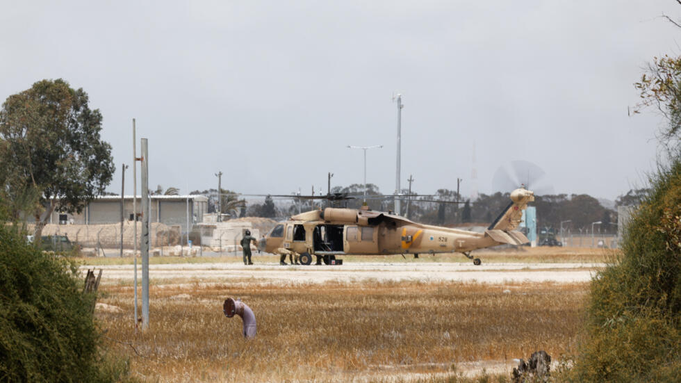 An Israeli military helicopter is seen, on the day Israeli-American hostage Edan Alexander, who was kidnapped during the deadly October 7 attack, is expected to be released by Hamas, in Reim, Israel M
