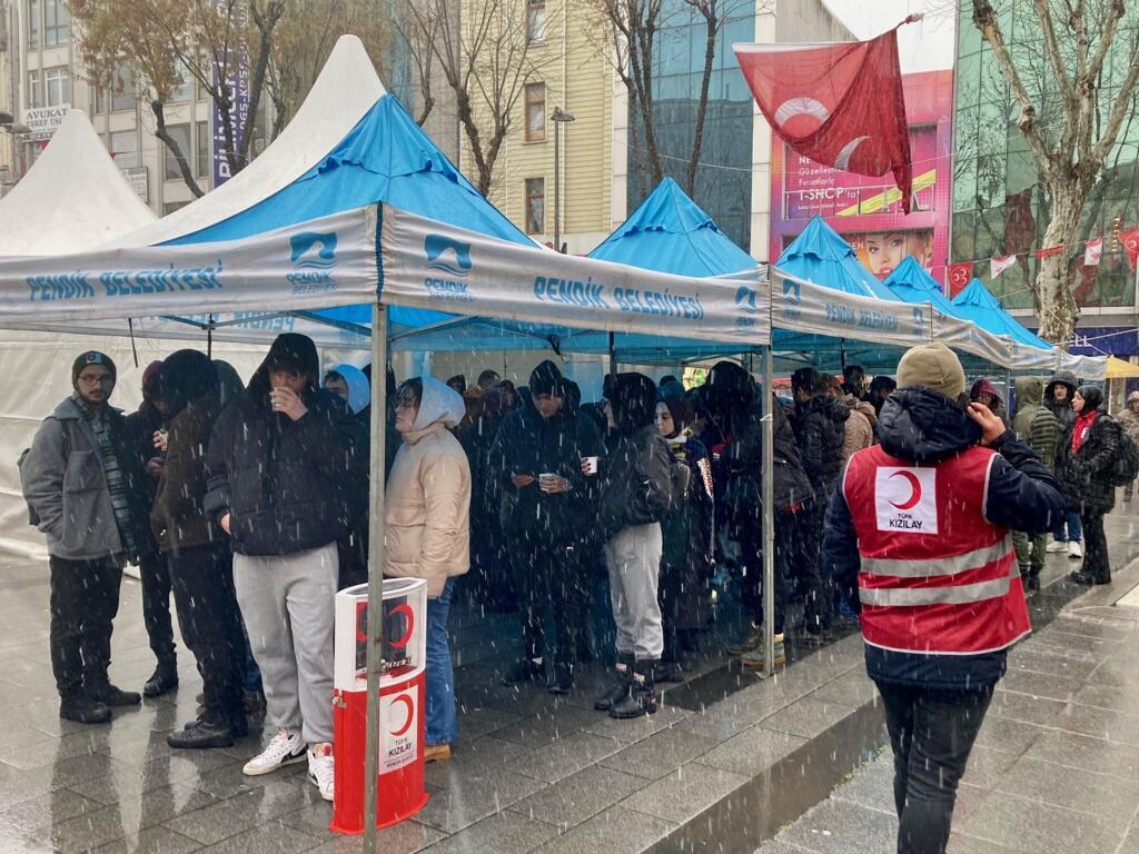 People wait in line to donate blood in Istanbul on 7 February 2023, at a blood drive organised by the Red Cross in the wake of the earthquakes that hit Turkey and Syria.