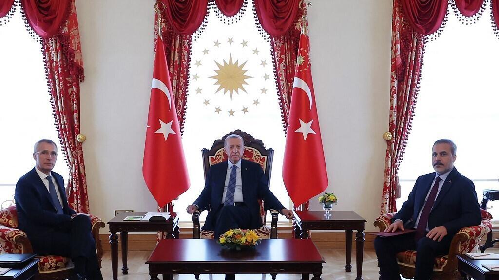 Turkish President Recep Tayyip Erdogan (C) NATO Secretary General Jens Stoltenberg (L) and Turkish Foreign Minister Hakan Fidan (R) meet in Istanbul June 4, 2023.