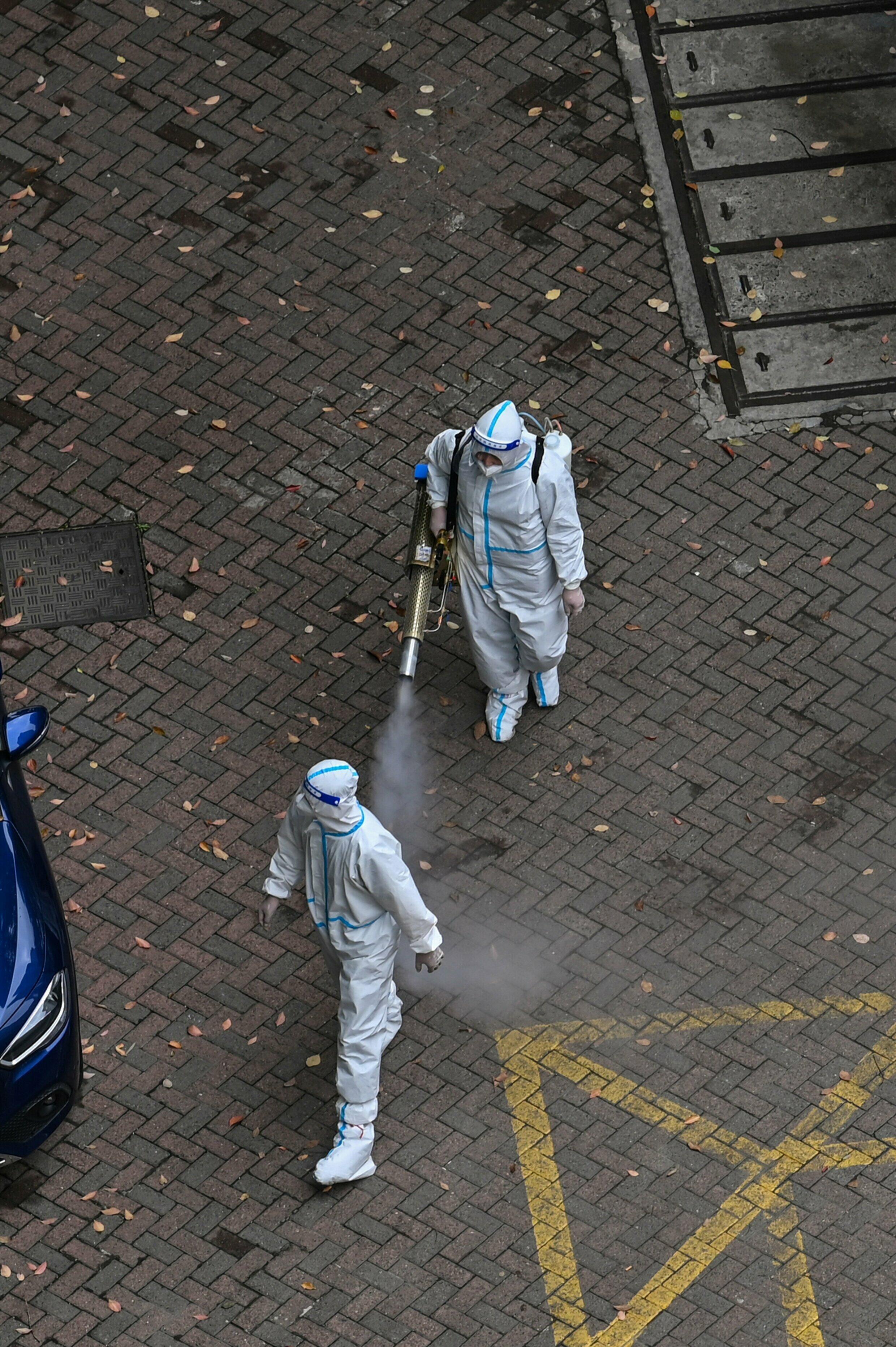 In a haze of disinfectant, China struggles with invisible enemy