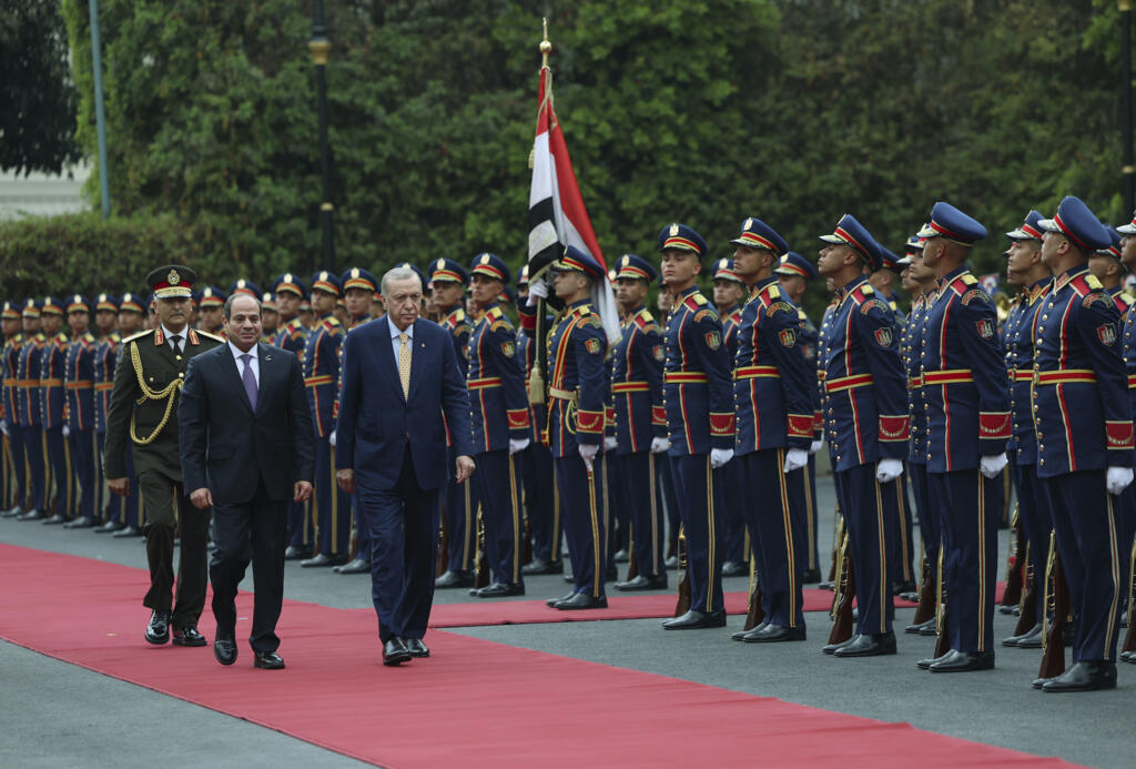 Turkey's President Recep Tayyip Erdogan and Egyptian President Abdel Fattah al-Sisi review an honour guard during their meeting at Al-Ittihadiya palace in Cairo, Egypt, on 14 February 2024.
