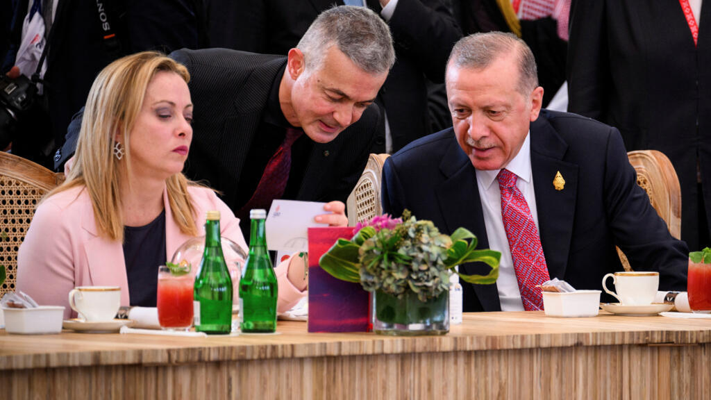 Prime Minister Giorgia Meloni of Italy (L) and President Recep Tayyip Erdogan of Turkey (R) chat ahead of a working lunch at the G20 Summit on November 15, 2022 in Nusa Dua, Indonesia.