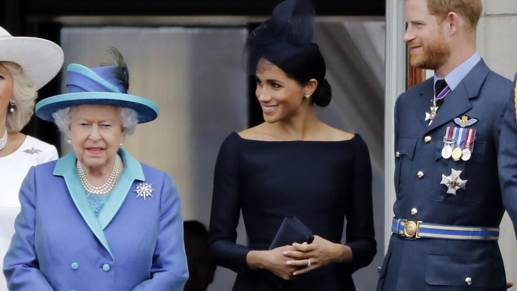 La Reine Elizabeth II, Meghan Markle et le prince Harry. 
