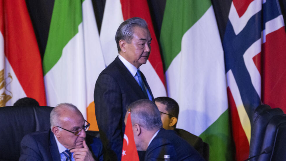 Chinese Foreign Minister Wang Yi arrives at the opening session of the G20 foreign ministers meeting in Johannesburg, South Africa, Thursday, Feb. 20, 2025.