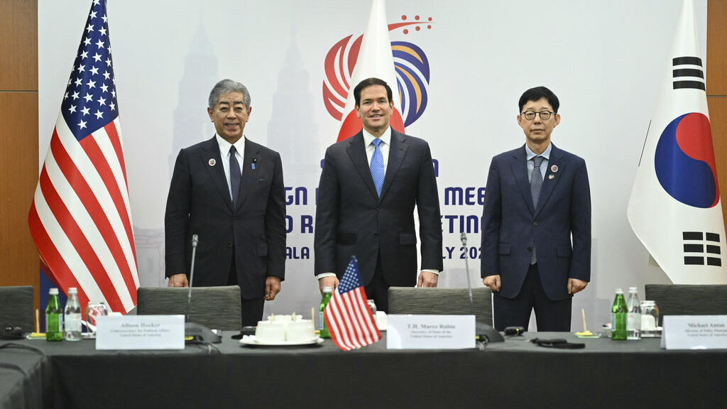 From left, Japan's Foreign Minister Takeshi Iwaya, U.S. Secretary of State Marco Rubio and South Korea's Vice Foreign Minister Park Yoonjoo pose for a photo at the start of their meeting on the sideli