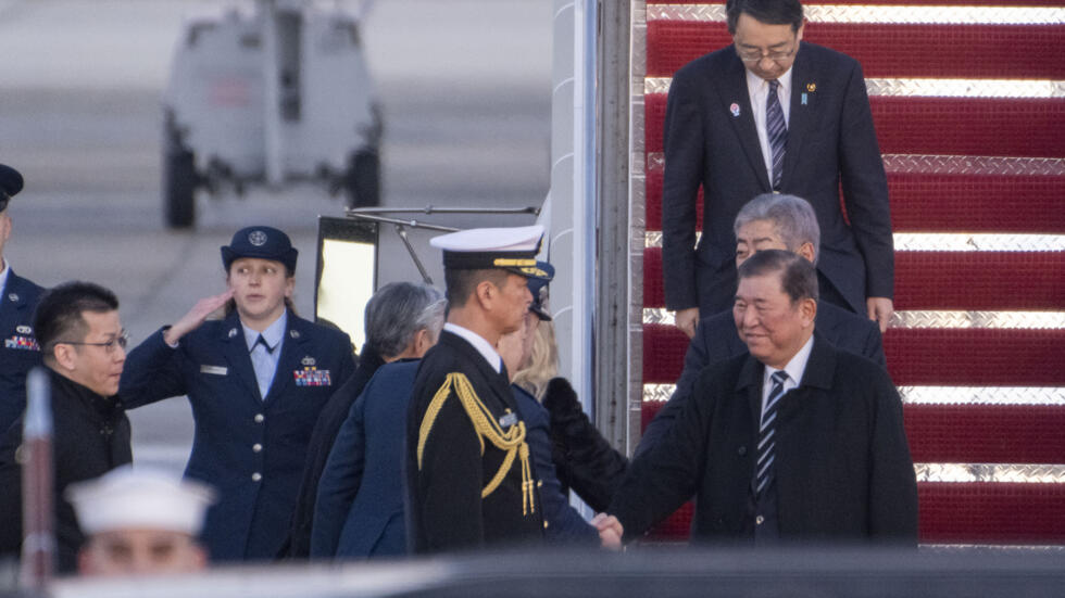 US JapanJapan's Prime Minister Shigeru Ishiba shakes hands as he is welcomed to Joint Base Andrews, Md., Thursday, Feb. 6, 2025. (AP Photo/Kevin Wolf)