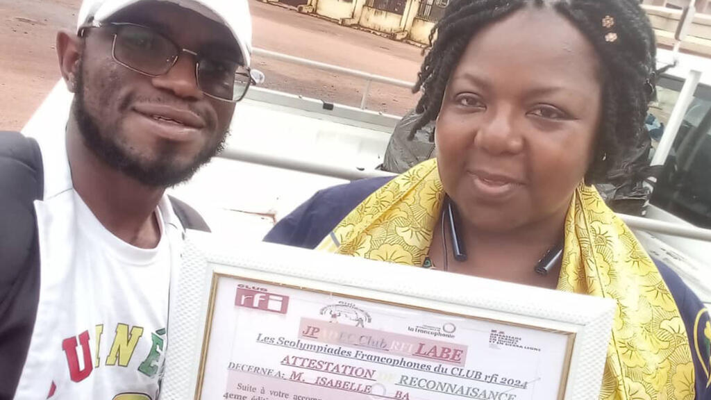 Saïfoulaye Diallo, président du club RFI Labé et Isabelle Ba, marraine du centre d'apprentissage.