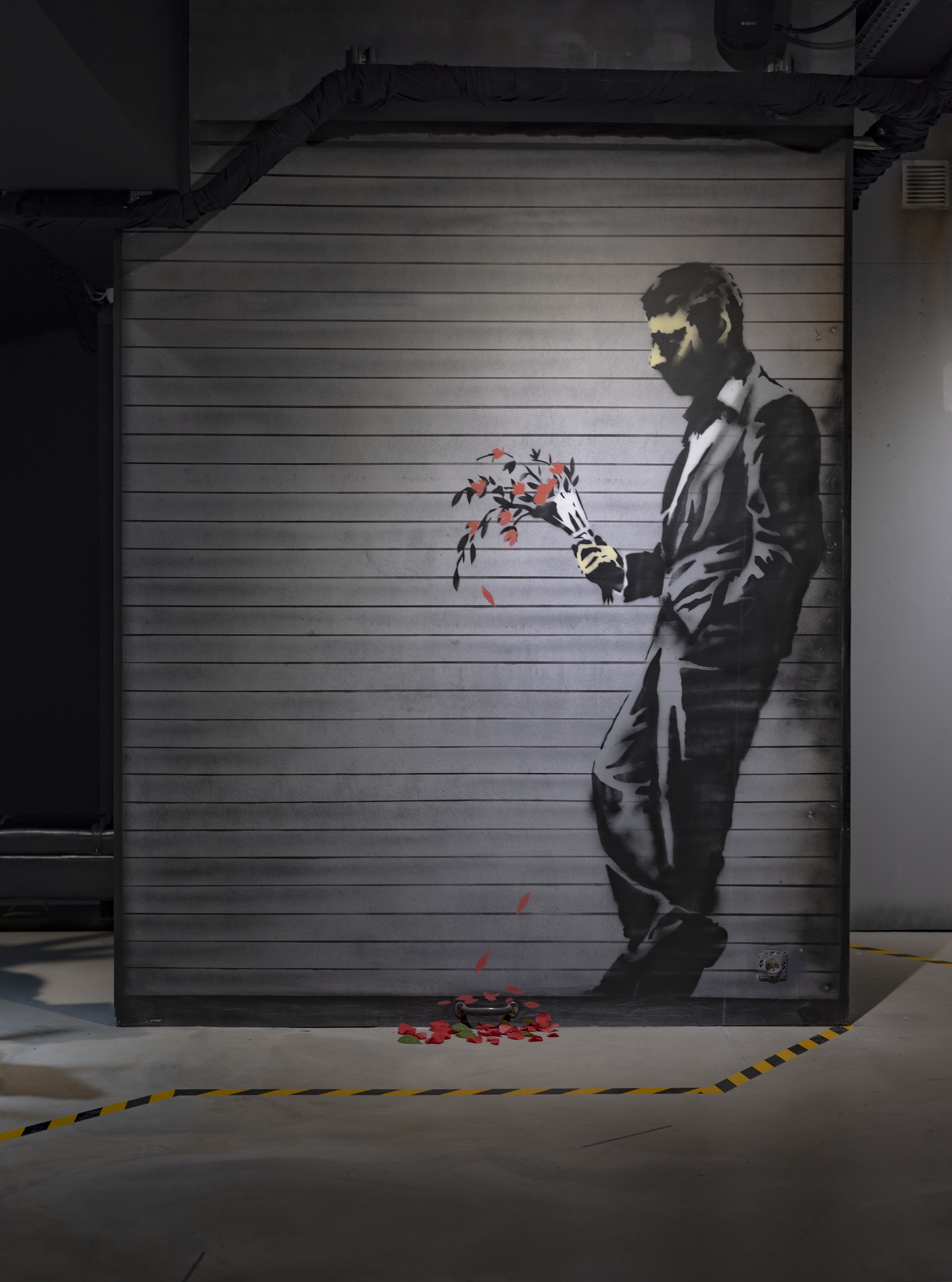 "Waiting In Vain… at the door of the club". Banksy dropped this image of a man waiting with his red fading flowers on the streets of New York City in 2013.